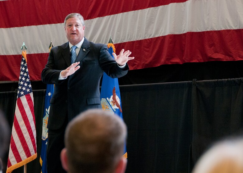 HANSCOM AIR FORCE BASE, Mass. -- Secretary of the Air Force Michael Donley addresses a packed crowd inside the Aero Club hangar during his visit here April 25. The secretary also met with military and civilian award winners and received briefings and technology demonstrations. Donley emphasized the value of work being done at Hanscom and also spoke about strategic Air Force issues and budget challenges. (U.S. Air Force Photo by Mark Wyatt)