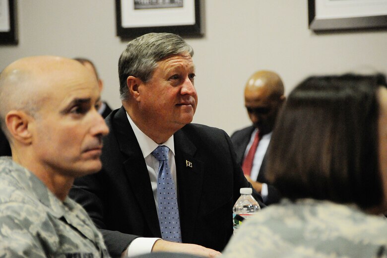 HANSCOM AIR FORCE BASE, Mass. -- Secretary of the Air Force Michael Donley and 66th Air Base Group Commander Col. Lester Weilacher look on during briefings here April 25. During his visit here, Donley met with military and civilian award winners, received briefings and technology demonstrations and held an Airman's call with base personnel. He also traveled to Cambridge, Mass., where he received the 2013 Doolittle Award from the MIT Security Studies Program. (U.S. Air Force Photo by Linda LaBonte Britt)