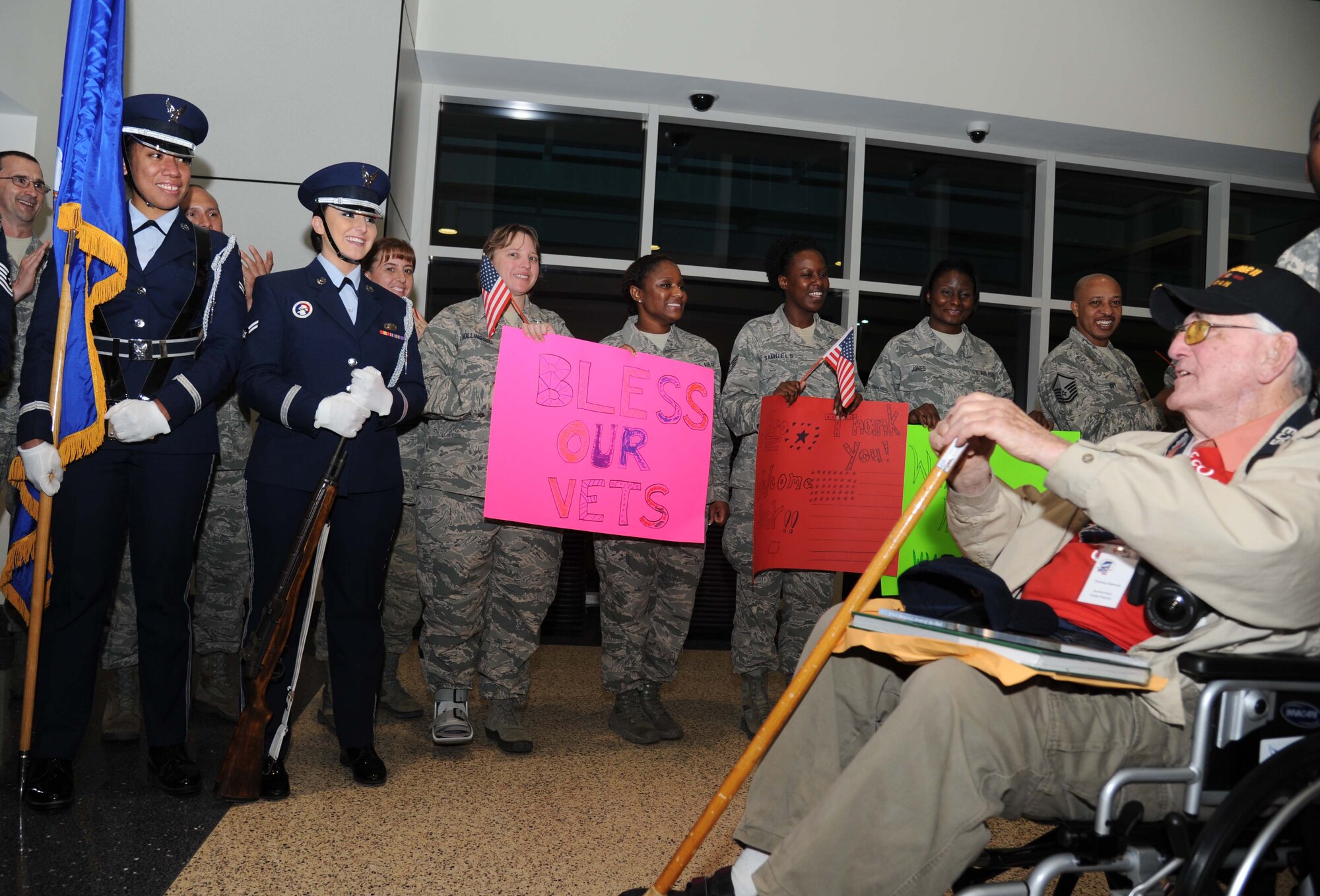 Keesler Honor Guard members and Airmen from the 335th Training Squadron show their respect to Thomas Osborne, World War II veteran, at the fifth Mississippi Gulf Coast Honor Flight to Washington, D.C., April 23, 2013, at the Gulfport/Biloxi International Airport.  The Honor Flight program honors our nation’s World War II veterans by sending them on a one-day visit to various monuments in Washington, D.C.  (U.S. Air Force photo by Kemberly Groue)
