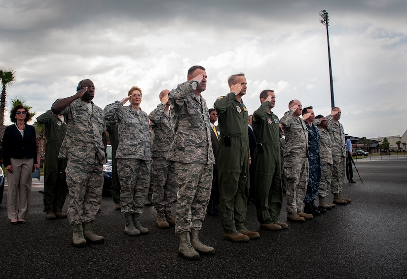 Joint Base Charleston leadership salute as Gen. Paul Selva, Air Mobility Command commander, delivers a brand new C-17 Globemaster III April 25, 2013, to Joint Base Charleston – Air Base, S.C., The first C-17 to enter the Air Force’s inventory arrived at Charleston Air Force Base in June 1993. The C-17 is capable of rapid strategic delivery of troops and all types of cargo to main operating bases or directly to forward bases in the deployment area. (U.S. Air Force photo/ Senior Airman Dennis Sloan)