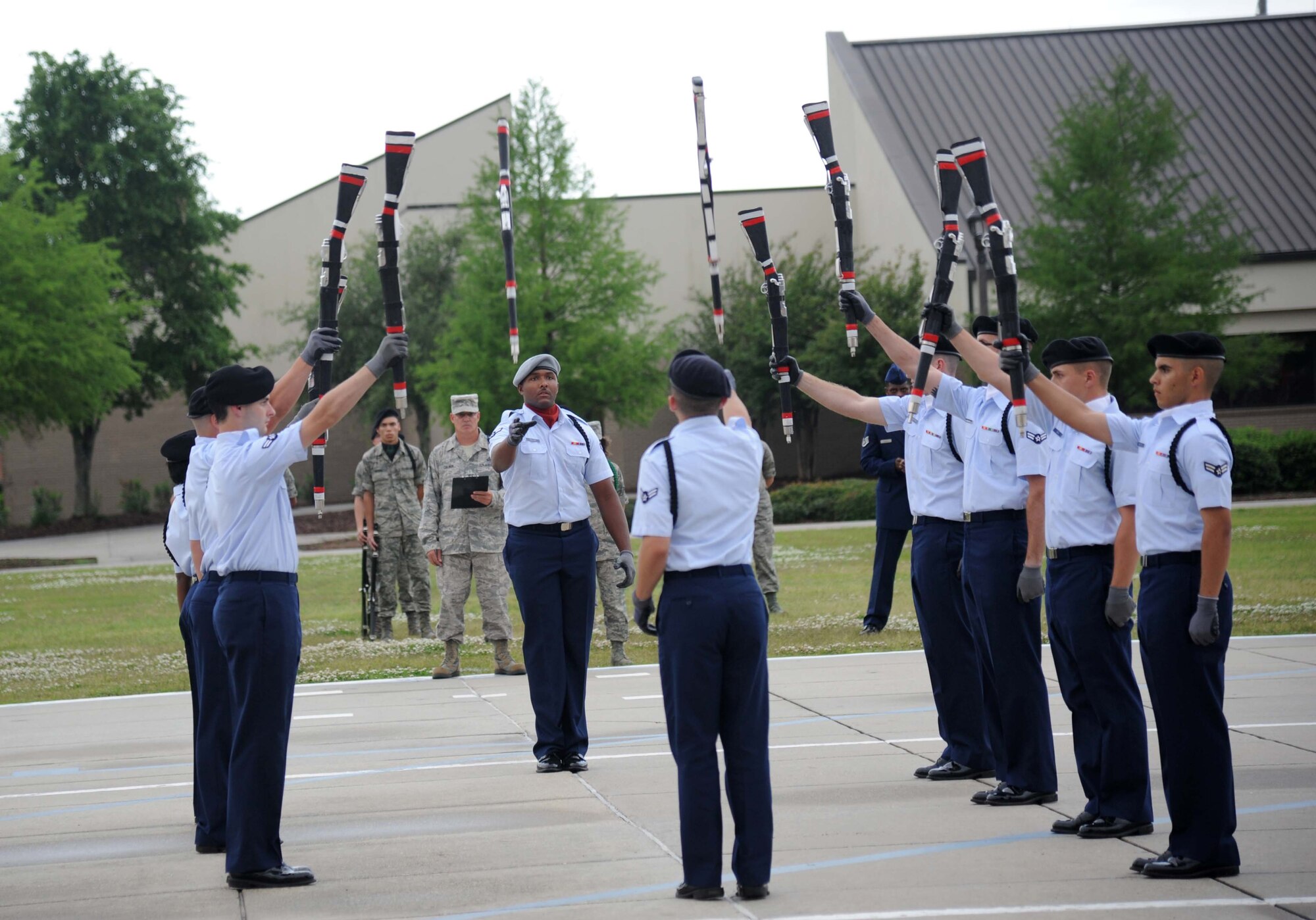 Members of the 335th Training Squadron perform in the freestyle drill competition during the 81st Training Group drill down performance April 24, 2013, at Keesler Air Force Base, Miss.  The 335th TRS made a clean sweep in the competition winning first place in every category to include open ranks, regulation, freestyle and overall.  (U.S. Air Force photo by Kemberly Groue)