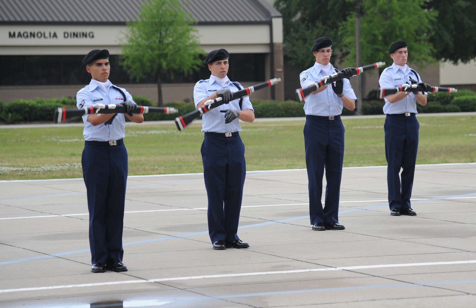 Members of the 335th Training Squadron perform in the freestyle drill competition during the 81st Training Group drill down performance April 24, 2013, at Keesler Air Force Base, Miss.  The 335th TRS made a clean sweep in the competition winning first place in every category to include open ranks, regulation, freestyle and overall.  (U.S. Air Force photo by Kemberly Groue)