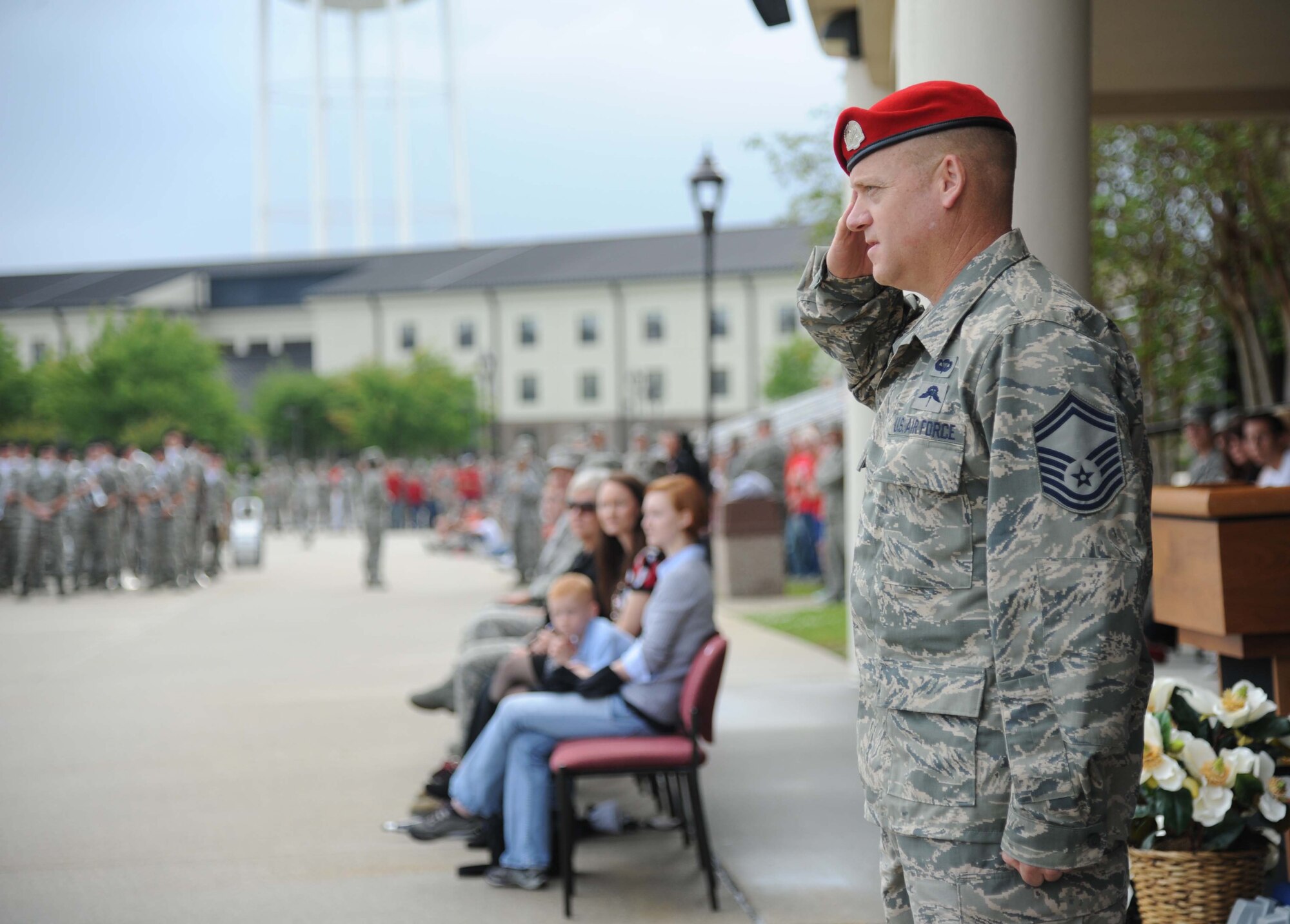 Senior Master Sgt. Bradley Reilly, 334th Training Squadron combat control instructor, renders a salute to a drill team as they enter the field of regulation during the 81st Training Group drill down performance April 24, 2013, at Keesler Air Force Base, Miss.  Reilly served as the reviewing official for the event.  (U.S. Air Force photo by Kemberly Groue)