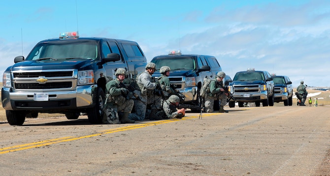 Ninetieth Security Forces Group defenders tactically position themselves during an inspection of the 90th Missile Wing on F. E. Warren Air Force Base, Wyo., April 12. (U.S. Air Force photo by Matt Bilden)