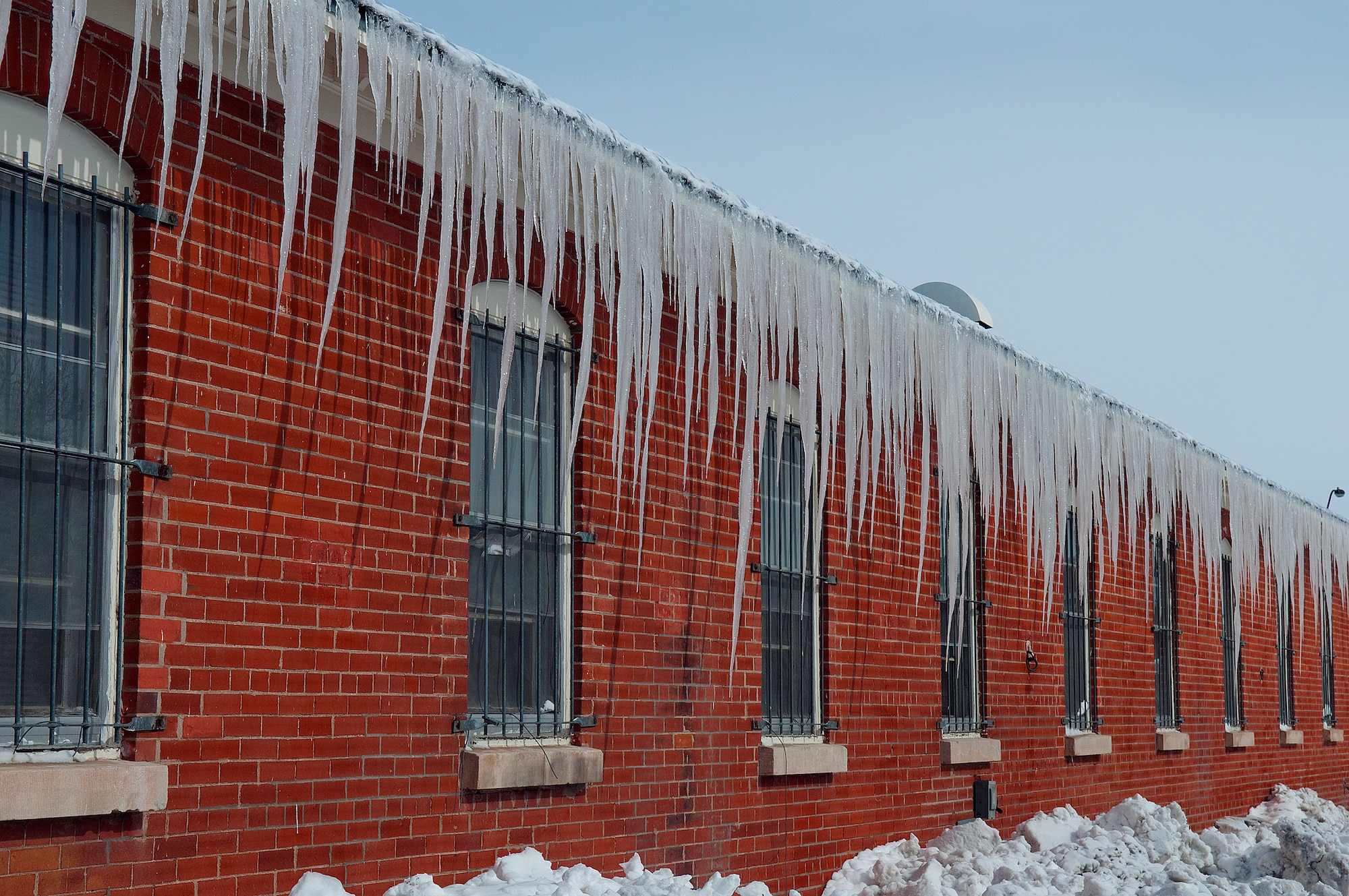 Long icicles hang from the roof of a building on F. E. Warren Air Force Base April 18. A two day spring snow storm blanketed the base with more than 19 inches of  snow. (U.S. Air Force photo by R.J. Oriez)