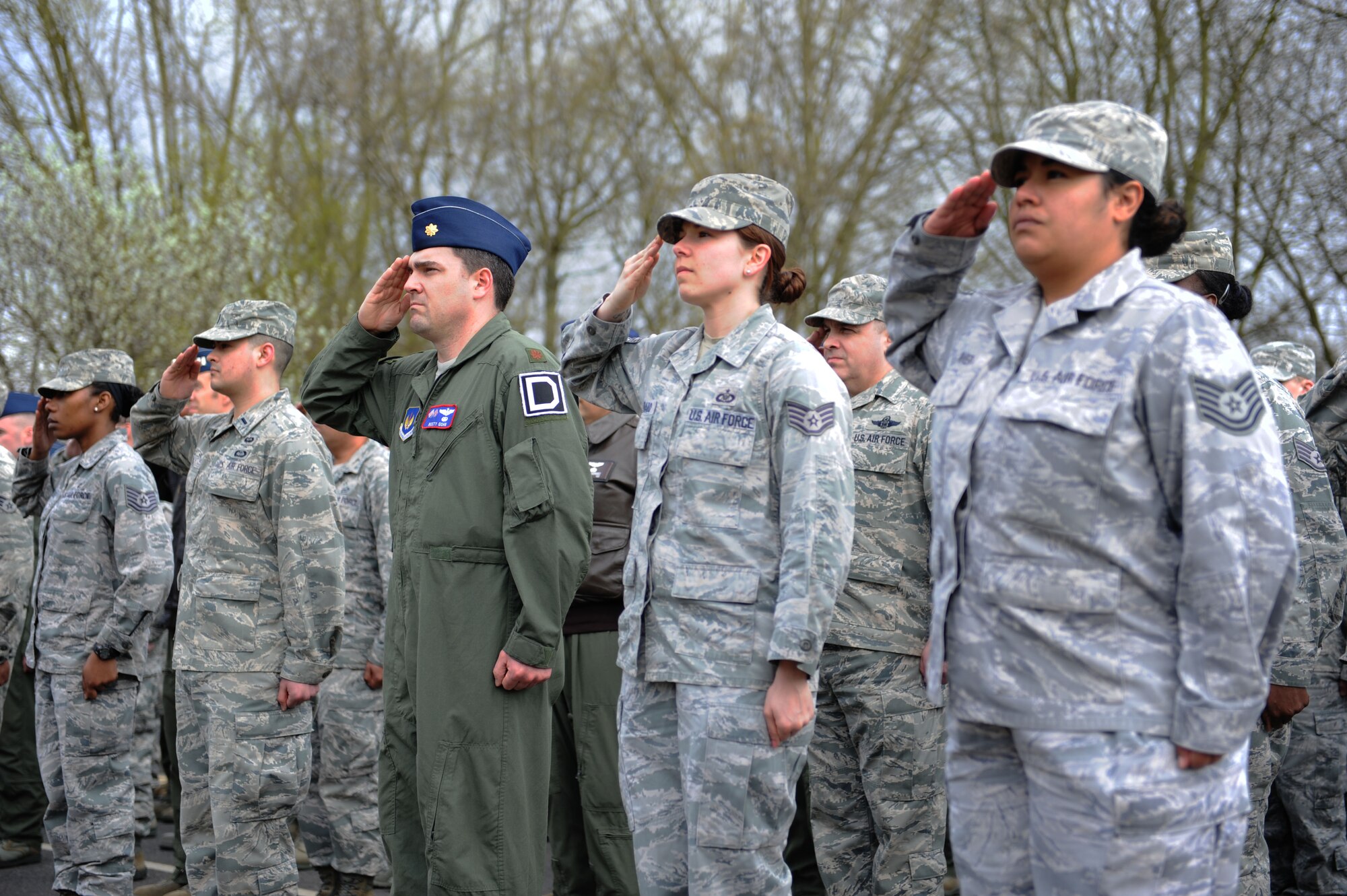 Members of the 100th Operations Group salute the U.S. flag as it’s lowered during the monthly retreat ceremony April 26, 2013, on RAF Mildenhall, England. Retreat is a long-standing tradition honoring the flag and signaling the end of the duty day. (U.S. Air Force photo by Airman 1st Class Preston Webb/Released)