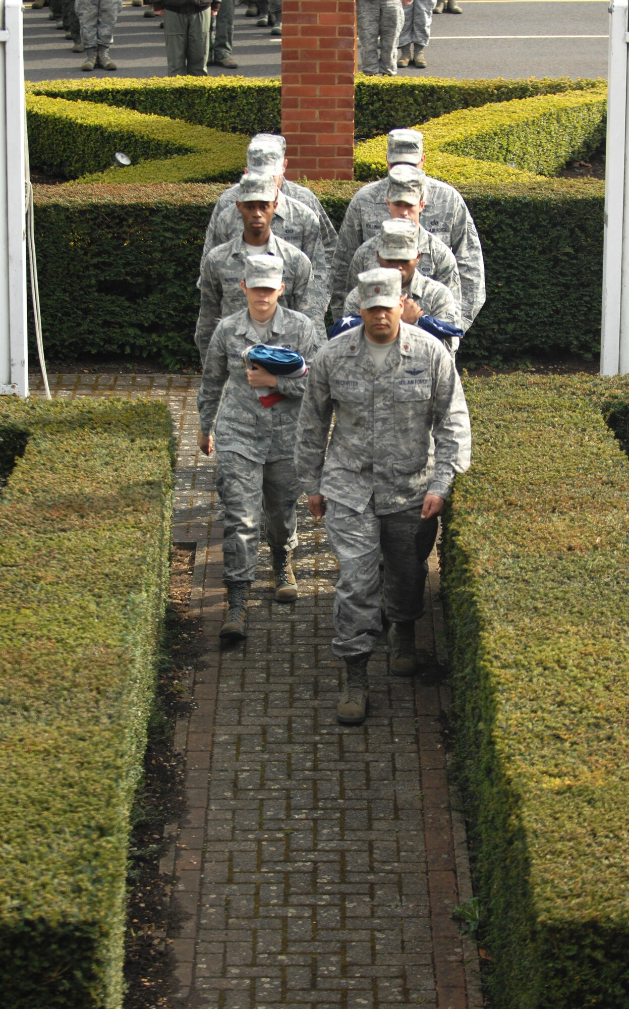 Members of the Team Mildenhall Honor Guard march during a retreat ceremony April 26, 2013, at RAF Mildenhall, England. A retreat ceremony, in which the U.S. and Royal Air Force flags are retired, takes place on the last Friday of every month. (U.S. Air Force photo by Airman 1st Class Dillon Johnston/Released)