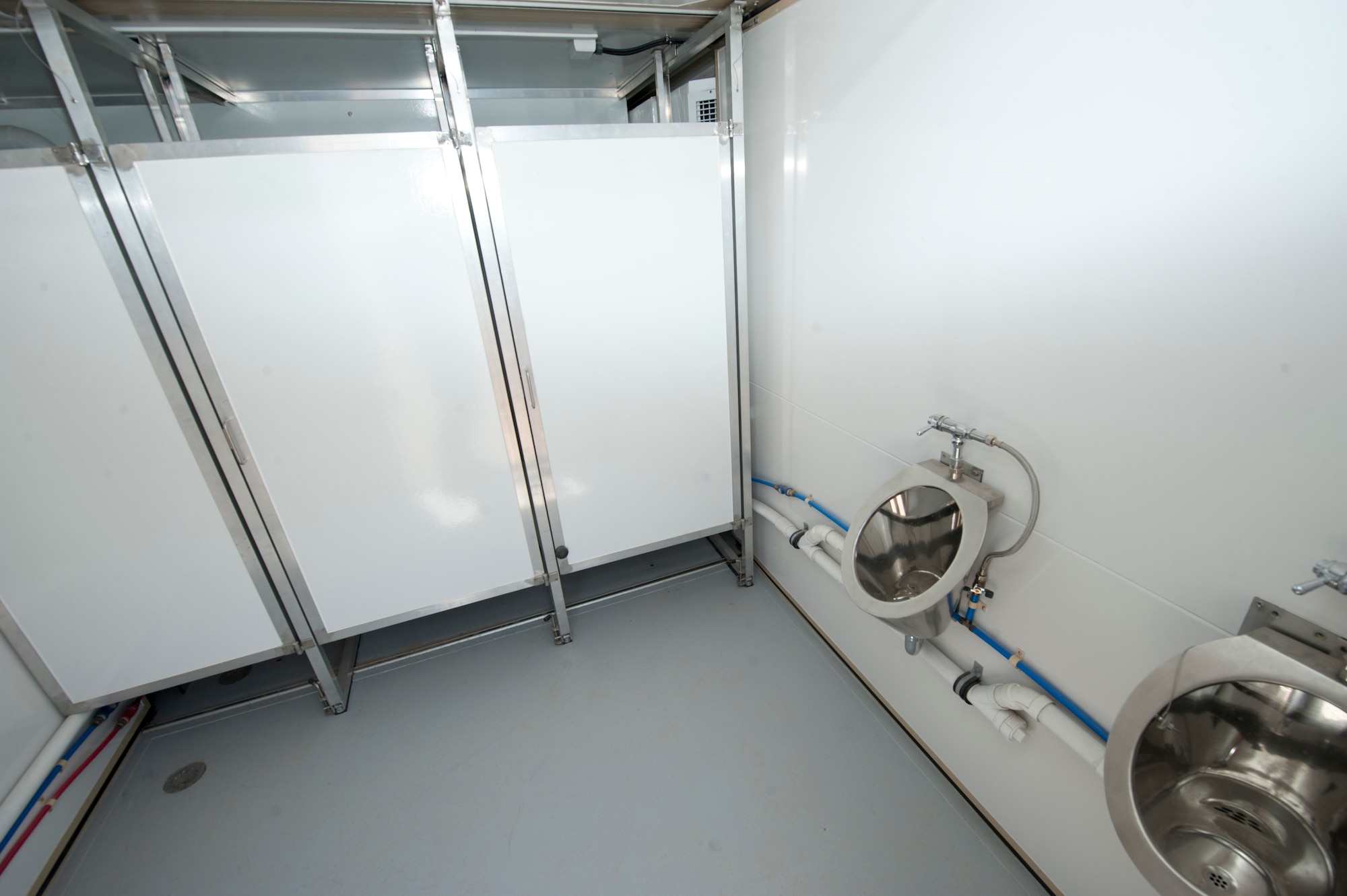 A new hygiene system’s latrine is fully assembled and tested at Holloman Air Force Base, N.M., April 24. The 49th Materiel Maintenance Squadron was the first unit to receive and test the new hygiene system, complete with latrines and showers, which will eventually be utilized in forward deployed locations. The new hygiene system provides a cleaner, more private, and more durable alternative to the old systems. (U.S. Air Force photo by Airman 1st Class Daniel E. Liddicoet)