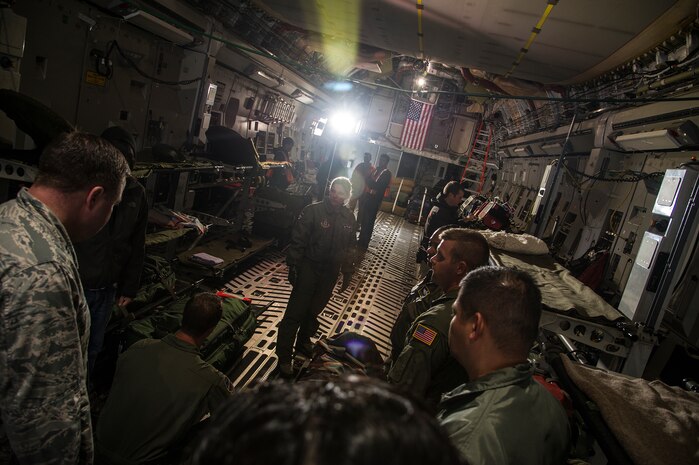 Film crew members of the “Army Wives” television series, brief Airmen on their roles as “extras” for an upcoming scene April 23, 2013, at Joint Base Charleston - Air Base, S.C. The roles of the Airmen, from the 315th Aeromedical Evacuation Squadron helped contribute to the realism of the scene. "Army Wives" tells the story of four women and one man who are brought together by their common bond - they all have military spouses. The series is based on the book "Under the Sabers: The Unwritten Code of Army Wives" by Tanya Biank and is produced by ABC Television Studio and The Mark Gordon Company. (U.S. Air Force photo/Staff Sgt. Rasheen Douglas)