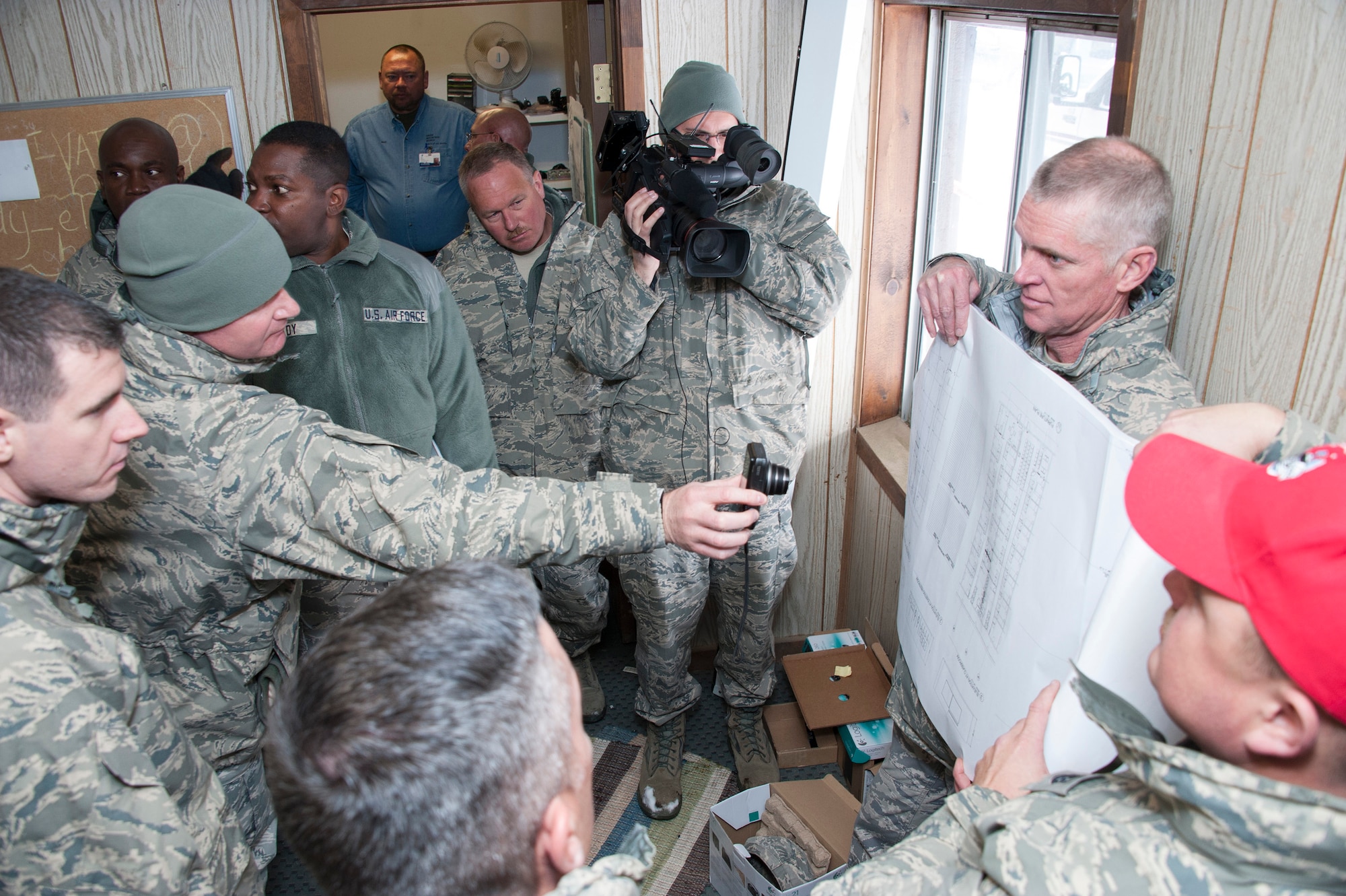 Lt. Col. Thomas Niichel holds blueprints of a dorm project for members from the Air National Guard as they perform a site survey at Snow Mountain Ranch, near Winter Park, Colo., in preparation for a renovation project that will take place this summer.  Civil Engineers will be rotating in and out throughout the summer from places such as Oklahoma City, Houston, Saint Croix, U.S. Virgin Islands, and St. Josephs, MO.  Project Sanctuary is a program that currently provides therapeutic, recreational retreats to military families to help reduce the negative effects of deployment. The CE effort will vastly improve and properly equip dorms for military members during their stay.  (U.S. Air National Guard photo by Senior Master Sgt. John Rohrer)