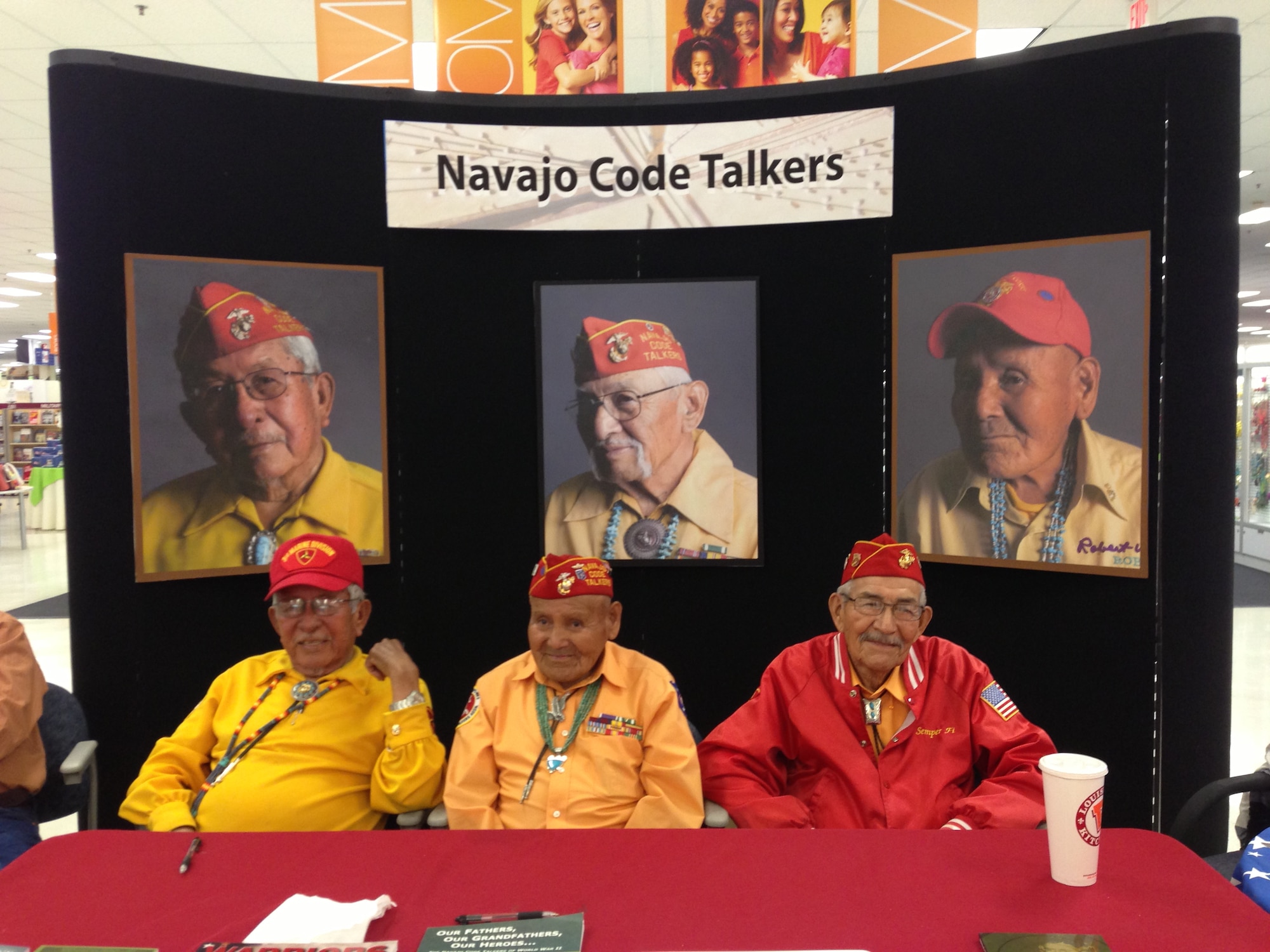 FROM LEFT: Bill Toledo, Robert Walley and Alfred Newman, World War II Navajo code talker veterans, pose for a photo April 12 at the Luke Air Force Base exchange. The three veterans visited Luke to educate the public about the Navajo Code Talkers and their role in WWII. (U.S. Air Force photo/Airman 1st Class Grace Lee)