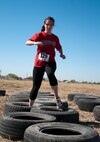 Amanda Warfield Crawl jumps through a tire obstacle in Del Rio’s first Battle on the Border Mud at the Val Verde County Fairgrounds April 20, 2013. The Del Rio Chamber of Commerce and 85th Flying Training Squadron's Booster Club brought the event together for Laughlin and local community members to have a day of family fun. (U.S. Air Force photo/Airman 1st Class Jimmie D. Pike)