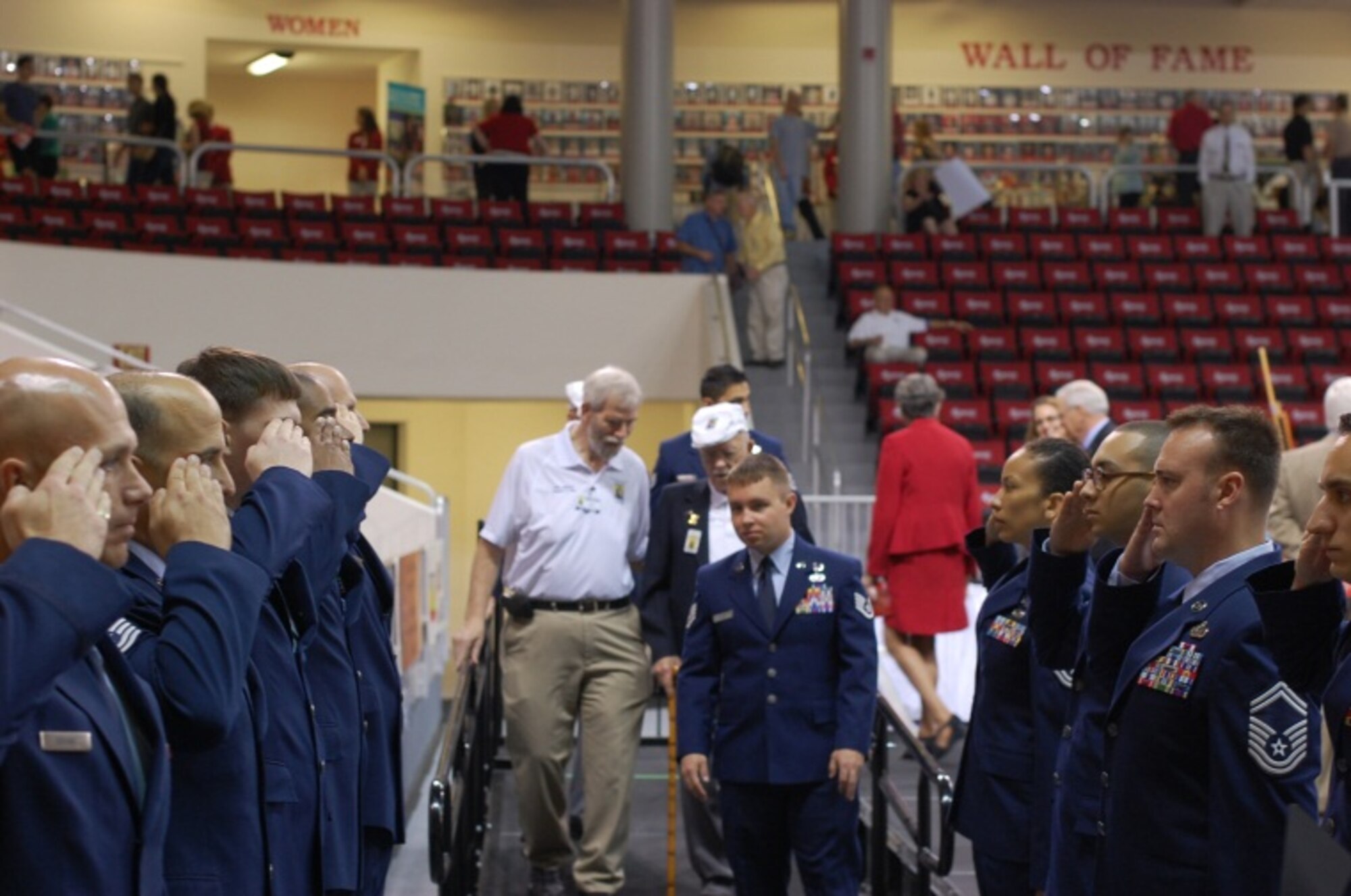 Airmen from 39th Information Operations Squadron render salutes to three Doolittle Raiders as they attend the dedication ceremony for the Doolittle Raider exhibit at the Northwest Florida State College in Fort Walton Beach, Fla., April 17, 2013. The event served as part of a week-long festivity in the Fort Walton Beach area to celebrate the 71st and final reunion of the surviving Raiders. (Courtesy photo)