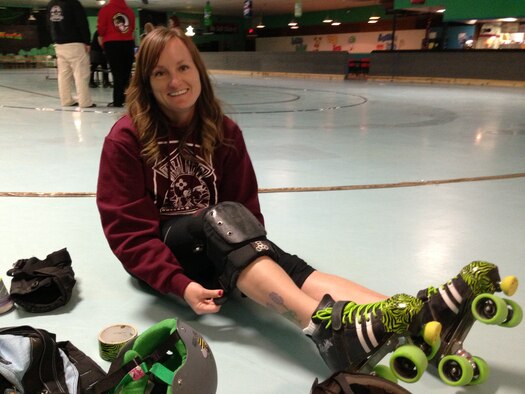 Carlye Sweet puts on her rollerskating gear before a roller derby bout April 20. Sweet is a first lieutenant at Holloman Air Force Base, N.M., and has been skating since she was about 2 years old. (Courtesy photo)