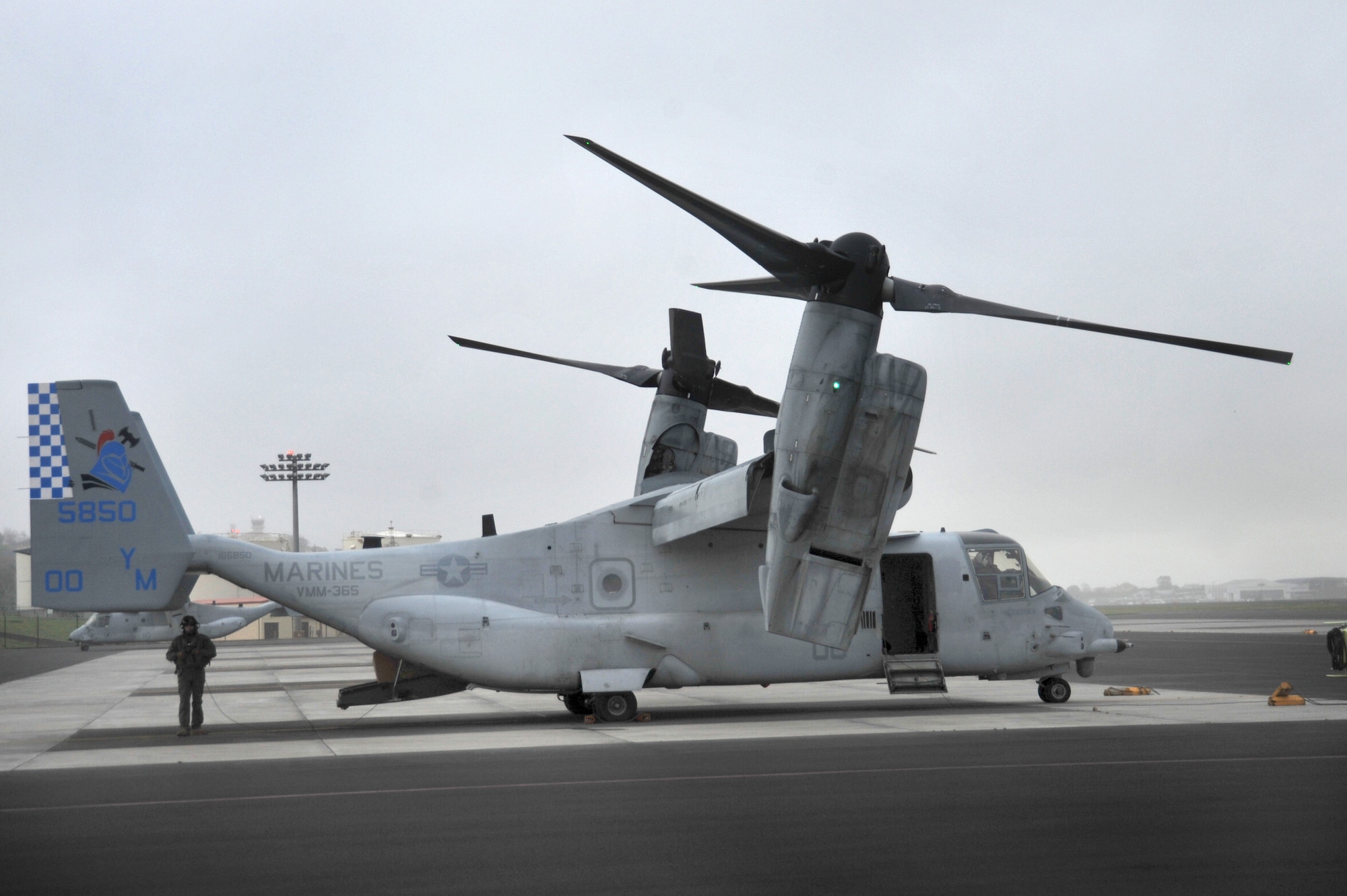 Members of the Marine Medium Tiltrotor Squadron 365 (VMM-365) and Marine Aerial Refueler Transport Squadron 252 stopped at Lajes Field during a transatlantic mission in support of a special Marine Air Ground Task Force-Crisis Response April 25. The crews are on their way to Moron, Spain, from Marine Corps Air Station New River, N.C., and MCAS Cherry Point, N.C.   Before their arrival, the 65th Operations Squadron coronet liaison, Tech. Sgt. Luke Adams, was their first point of contact at Lajes Field, as he is for all U.S. and foreign fighter and refueling aircraft coming through, to and from Lajes. (U.S. Air Force photo by Staff Sgt. Angelique N. Smythe/released)