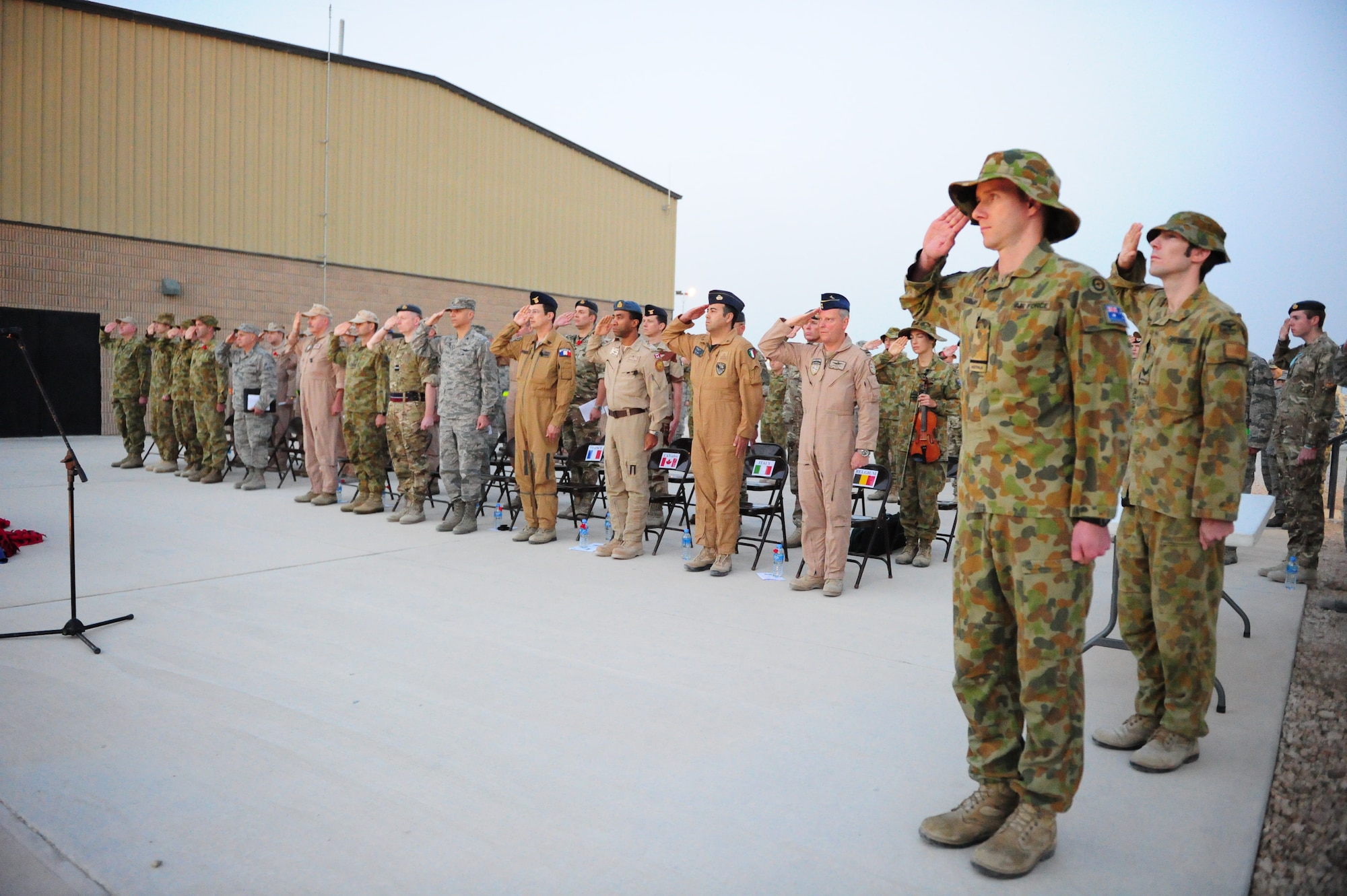 SOUTHWEST ASIA – The Royal Australian Air Force invited the Grand Slam Wing to take part in a dawn, wreath-laying service April 25 to remember all who served and died in all wars, conflicts and peacekeeping operations in which Australian and New Zealand defense forces have been engaged. The dawn service focuses on the quiet moments before dawn during conflict, where soldiers were woken up to “stand-to” in the quiet moments before another day of battle would begin. The Thursday morning ceremony here began at 4:20 a.m. – the time ANZAC Forces made landfall on Gallipoli in 1915 -- hosted by RAAF Task Unit 633.2.5 Wing Commander Paul Gibbs, followed by a hymn, dedication, sonnet and requiem. Coalition representatives here laid a wreath, including the Australians, New Zealanders, British, Americans, French, Canadians, Italians and Belgians. After the laying of wreaths, an ode of remembrance was read before a playing of the last post. After the moment of silence, reveille played, a prayer given and the ceremony concluded with the national anthems of Australia and New Zealand. (U.S. Air Force photo/Master Sgt. Brendan Kavanaugh)