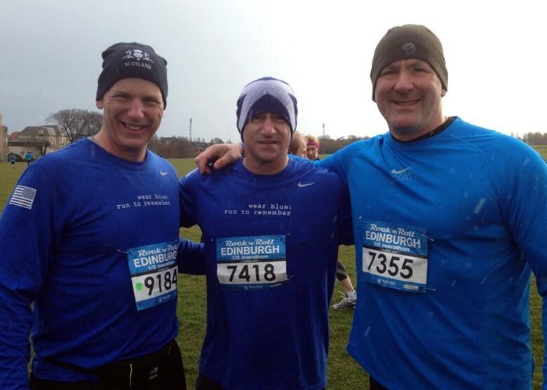 From left, Chief Master Sgt. Gregory Warren, 100th Operations Group chief, U.S. Army Command Sgt. Maj. Matt Barnes and Chief Master Sgt. William Markham, 352nd Special Operations Group command chief, prepare to run the 2013 Rock-n-Roll Half-Marathon in Edinburgh, Scotland. The race course started and finished at Holyrood Park in Edinburgh, Scotland. (Courtesy photo/Released)