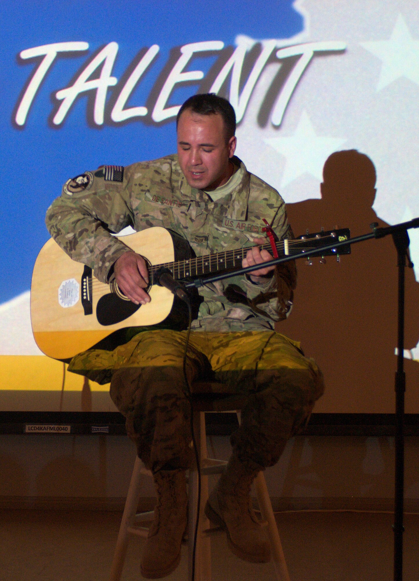 Staff Sgt. Nickolas De Santis, 451st Expeditionary Maintenance Squadron, performs during the Kandahar’s Got Talent competition at Kandahar Air Field April 24. De Santis won the competition, which was organized by the 451st Expeditionary Force Support Flight. (U.S. Air Force photo by Capt. Brian Maguire)