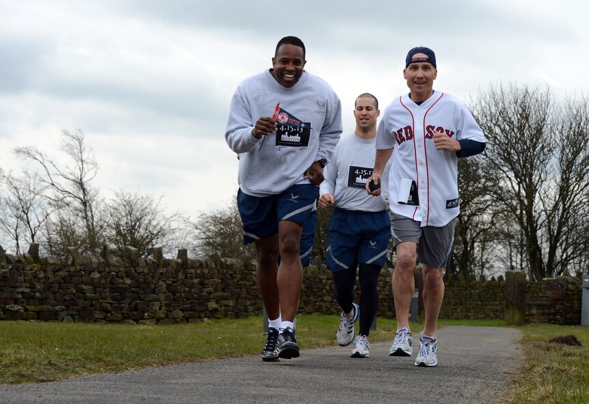 RAF MENWITH HILL, United Kingdom – (left to right) Senior Master Sgt. Andres Grant, Tech. Sgt. Ivan Abudo and Mark Gagnon, all from the 421st Air Base Group, smile as they run the “Boston Mile,” a mile of remembrance, which was held April 22 in order to honor and show support to the victims of the Boston Marathon bombing April 15. Roughly 80 people from around base joined together to run or walk in remembrance. (U.S. Air Force photo by Staff Sgt. Debbie Lockhart)