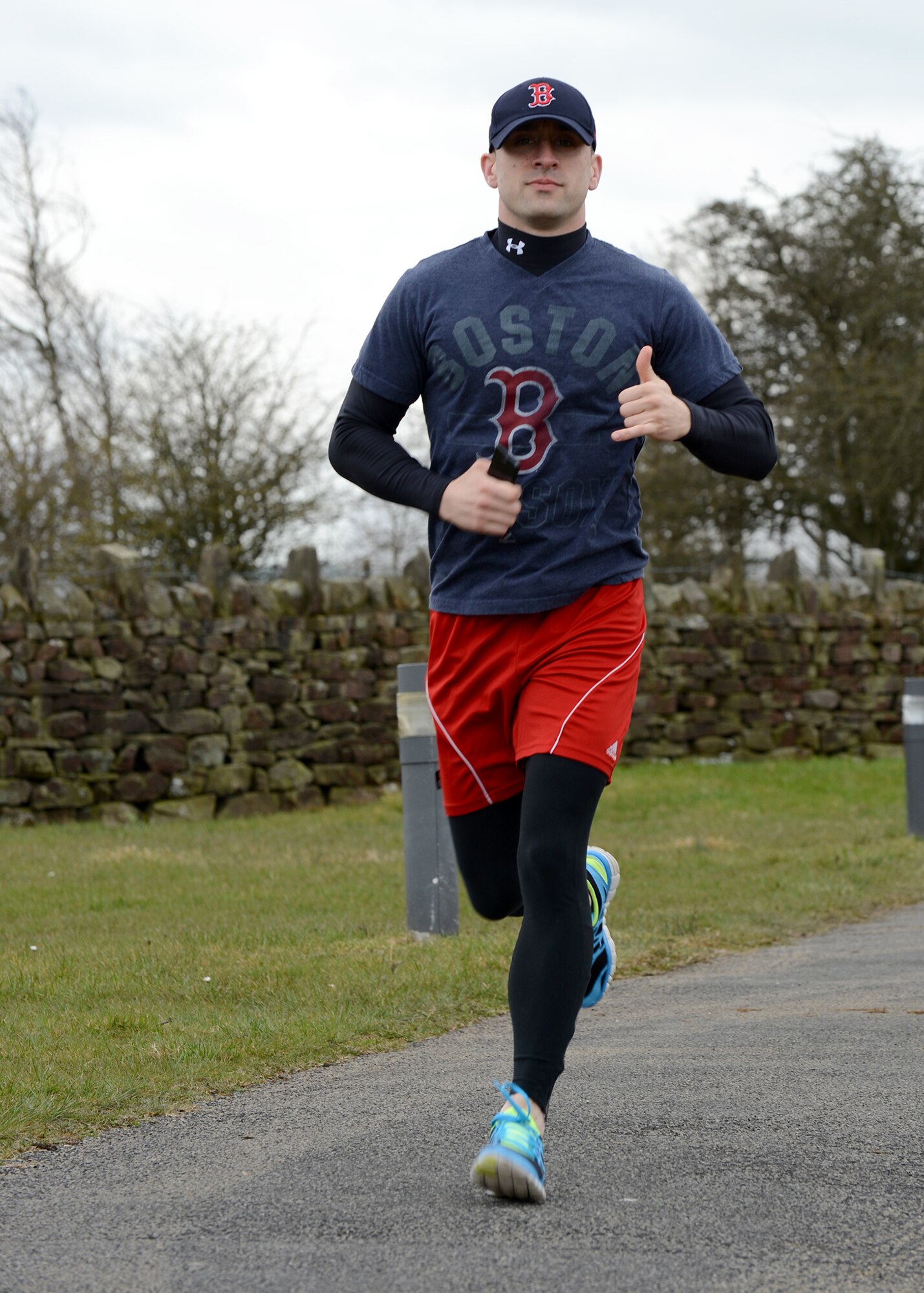 RAF MENWITH HILL, United Kingdom – U.S. Army Sgt. David Sergienko, 709th Military Intelligence Battalion, runs the “Boston Mile,” a mile of remembrance, which was held April 22 in order to honor and show support to the victims of the Boston Marathon bombing April 15. Roughly 80 people from around base joined together to run or walk in remembrance. (U.S. Air Force photo by Staff Sgt. Debbie Lockhart)