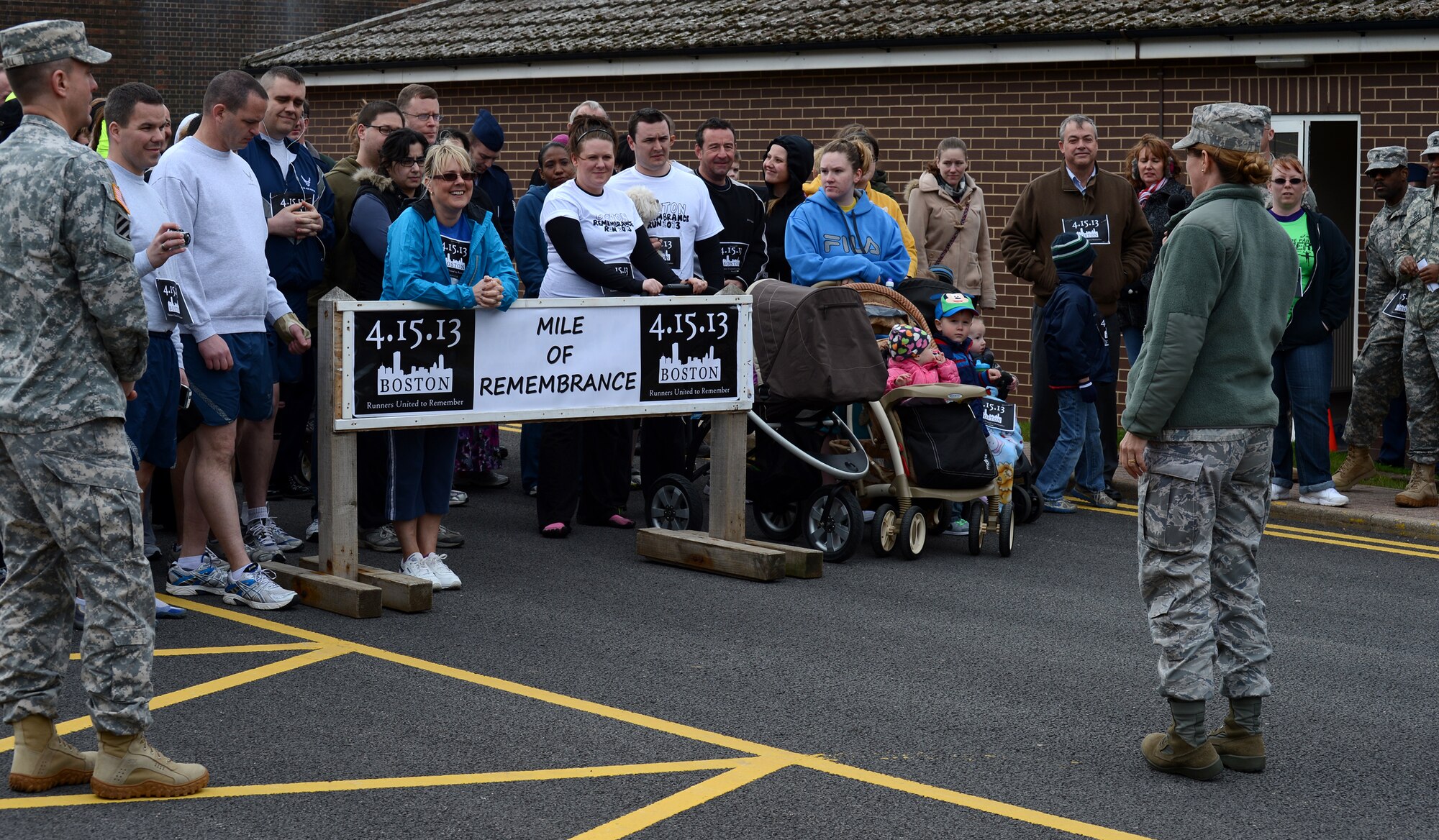 RAF MENWITH HILL, United Kingdom – Col. Mary Boucher, 421st Air Base Group commander, speaks to members of the Menwith Hill Station community before the start of the “Boston Mile,” a mile of remembrance, which was held April 22 in order to honor and show support to the victims of the Boston Marathon bombing April 15. Roughly 80 people from around base joined together to run or walk in remembrance. (U.S. Air Force photo by Staff Sgt. Debbie Lockhart)