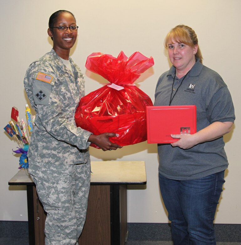 ALBUQUERQUE, N.M., -- Lt. Col. Gant presents the District's 2013 Administrative Professional of Year Award to Ms. Toni Brown of the Santa Rosa Lake Project Office.