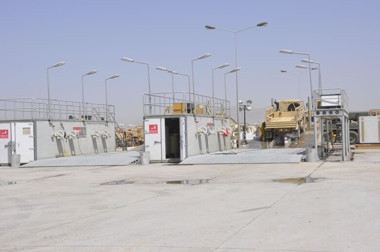 The Theater Vehicle Maintenance Facility at Kandahar Airfield meets a critical need to get mine-resistant, ambush protected vehicles back in service in Afghanistan after needed repairs. The facility received a Silver Award in an engineering competition sponsored by the American Council of Engineering Companies of Massachusetts. (USACE photo – Karla Marshall)