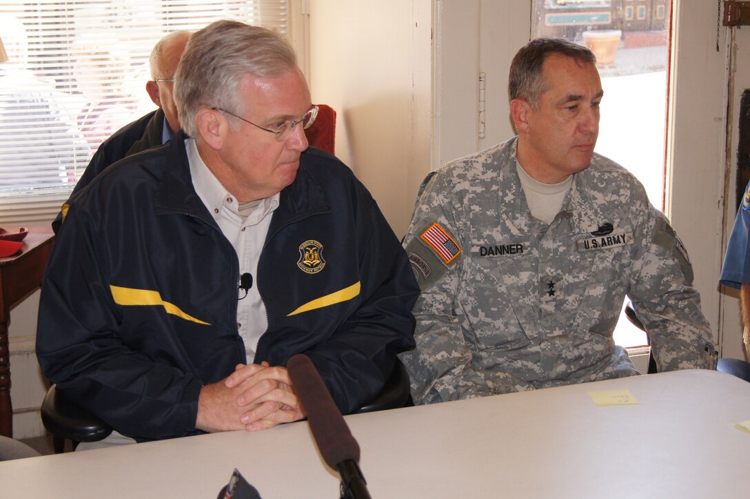 Missouri Gov. Jay Nixon, left, and U.S. Army Maj. Gen. Steve Danner, Missouri National Guard adjutant general, attend a briefing at city hall before touring flooded areas along the Mississippi River in Clarksville, Mo., April 20, 2013. 