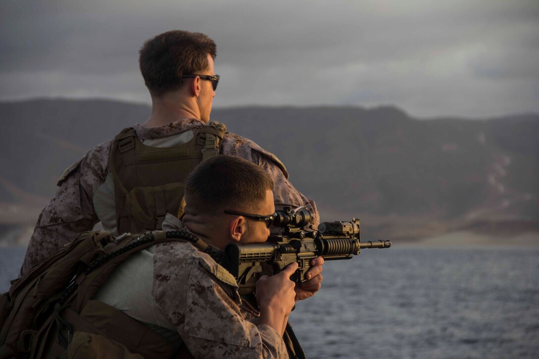 U.S. Marines and Sailors from Combat Logistics Battalion (CLB) 26, 26th Marine Expeditionary Unit (MEU), sight in on the beach while riding a Navy Landing Craft, Utility (LCU) in the 5th Fleet area of responsibility, April 20, 2013. The 26th MEU is currently deployed as part of the Kearsarge Amphibious Ready Group to the 5th Fleet area of responsibility. The 26th MEU operates continuously across the globe, providing the president and unified combatant commanders with a forward-deployed, sea-based quick reaction force. The MEU is a Marine Air-Ground Task Force capable of conducting amphibious operations, crisis response, and limited contingency operations.
(U.S. Marine Corps photo by Cpl. Michael S. Lockett/Released)
