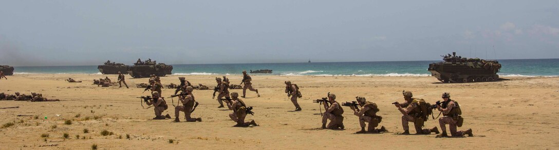 U.S. Marines and Sailors from Company K, Battalion Landing Team (BLT) 3/2, 26th Marine Expeditionary Unit (MEU), conduct a simulated mechanized amphibious assault on a beach in the 5th Fleet area of responsibility, April 20, 2013. The 26th MEU is currently deployed as part of the Kearsarge Amphibious Ready Group to the 5th Fleet area of responsibility. The 26th MEU operates continuously across the globe, providing the president and unified combatant commanders with a forward-deployed, sea-based quick reaction force. The MEU is a Marine Air-Ground Task Force capable of conducting amphibious operations, crisis response, and limited contingency operations.
(U.S. Marine Corps photo by Cpl. Michael S. Lockett/Released)
