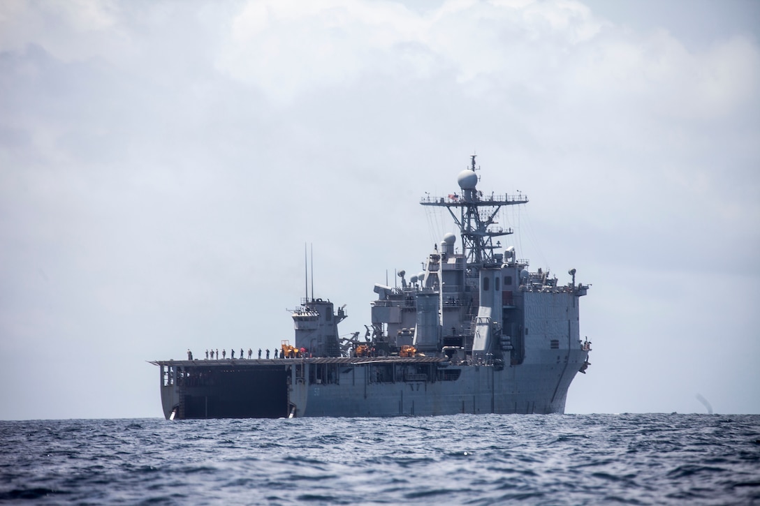 The USS Carter Hall (LSD 50) sails off in the distance after launching amphibious assault vehicles from the 26th Marine Expeditionary Unit (MEU) in the 5th Fleet Area of Operation, April 20, 2013. The 26th MEU is currently deployed as part of the Kearsarge Amphibious Ready Group to the 5th Fleet area of responsibility. The 26th MEU operates continuously across the globe, providing the president and unified combatant commanders with a forward-deployed, sea-based quick reaction force. The MEU is a Marine Air-Ground Task Force capable of conducting amphibious operations, crisis response, and limited contingency operations.
(U.S. Marine Corps photo by Staff Sgt. Edward Guevara/Released)