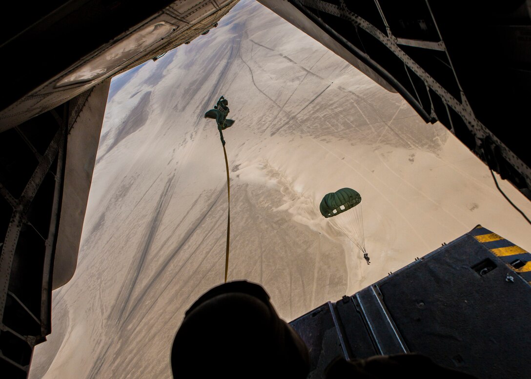 26th Marine Expeditionary Unit (MEU) Maritime Raid Force Marines exit the back of a CH-53E Super Stallion assigned to Marine Medium Tiltrotor Squadron (VMM) 266 Reinforced, while conducting a parachute operation during Exercise Eagle Reslove over Qatar, April 26, 2013. Eagle Resolve is an annual multilateral exercise designed to enhance regional cooperative defense efforts in the Gulf Cooperation Council nations and U.S. Central Command. The 26th MEU is deployed to the 5th Fleet area of operations aboard the Kearsarge Amphibious Ready Group. The 26th MEU operates continuously across the globe, providing the president and unified combatant commanders with a forward-deployed, sea-based quick reaction force. The MEU is a Marine Air-Ground Task Force capable of conducting amphibious operations, crisis response and limited contingency operations.  (U.S. Marine Corps photo by Cpl. Christopher Q. Stone, 26th MEU Combat Camera/Released)