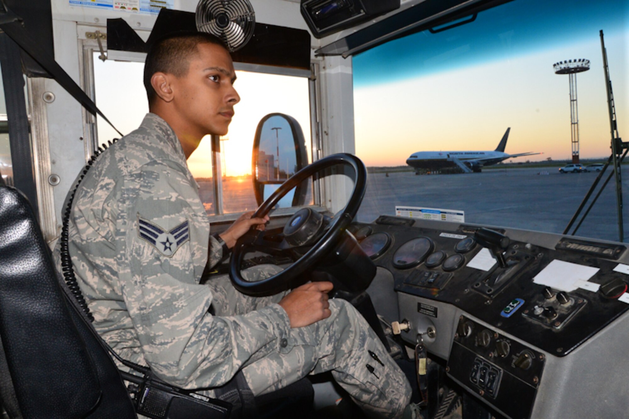 Senior Airman Videsh Singh, 376th Expeditionary Logistics Readiness Squadron passenger terminal vehicle operator, waits to deliver troops to an aircraft April 21, 2013, at Transit Center at Manas, Kyrgyzstan. The passenger terminal transports an average of 1,000 to 2,000 troops a day. Singh is deployed from Homestead Air Reserve Base, Fla., and is a native of Coral Springs, Fla. (U.S. Air Force photo/Tech. Sgt. Robert Gibson) 
