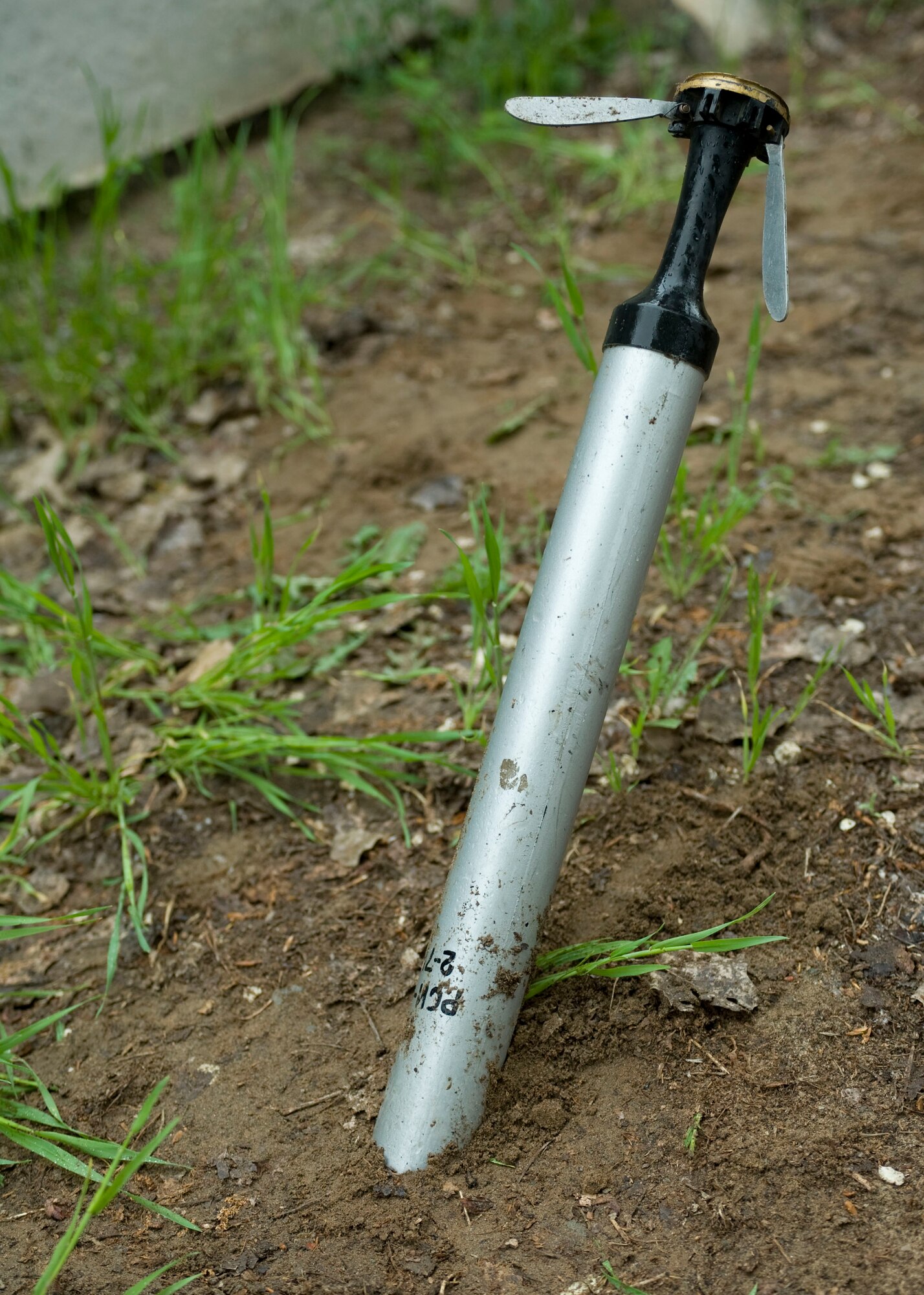 A 57mm training rocket sticks out of the ground during an EOD military exchange April, 24, 2013, at Transit Center at Manas, Kyrgyzstan.  The rocket was used to demonstrate and train on proper removal techniques during a military exchange between U.S. Armed Forces and Kyrgyz Republic Ministry of Defense. (U.S Air Force photo/Staff Sgt. Stephanie Rubi)