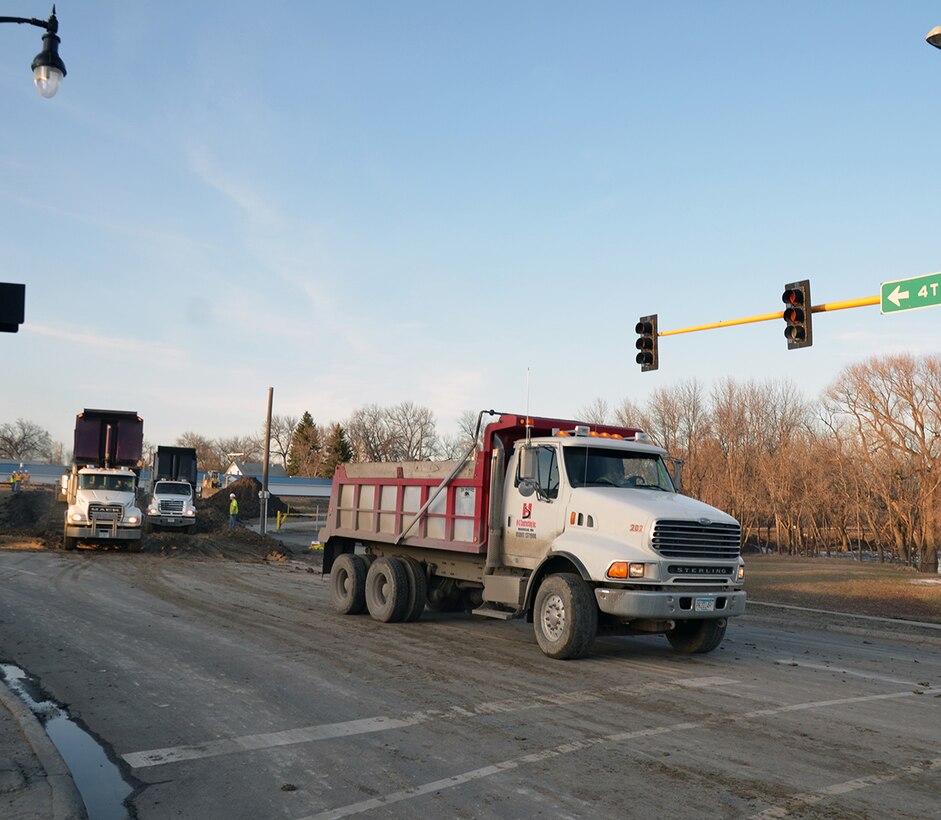 Contractors working for the Corps of Engineers, St. Paul District drop the first loads of dirt to help build a temporary levee along 2nd Street in Fargo to help protect the city from flooding due to the rising Red River of the North April 26. This is the fourth time in the past five years that the Corps has supported the city’s flood fight. USACE photo by Patrick Moes