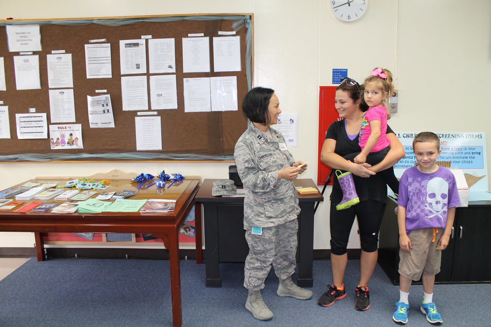 U.S. Air Force Capt. (Dr.) Enrilyn Thronson, Kadena pediatrician, answers a patron’s question during a Month of the Military Child event on Kadena Air Base, Japan, April 19, 2013. The Kadena CDCs and pediatric clinic have also partnered to save parents time during medical appointments by recommending they keep a copy of their completed Ages and Stages Questionnaire to provide to their pediatrician during well-child appointments. (Courtesy photo)