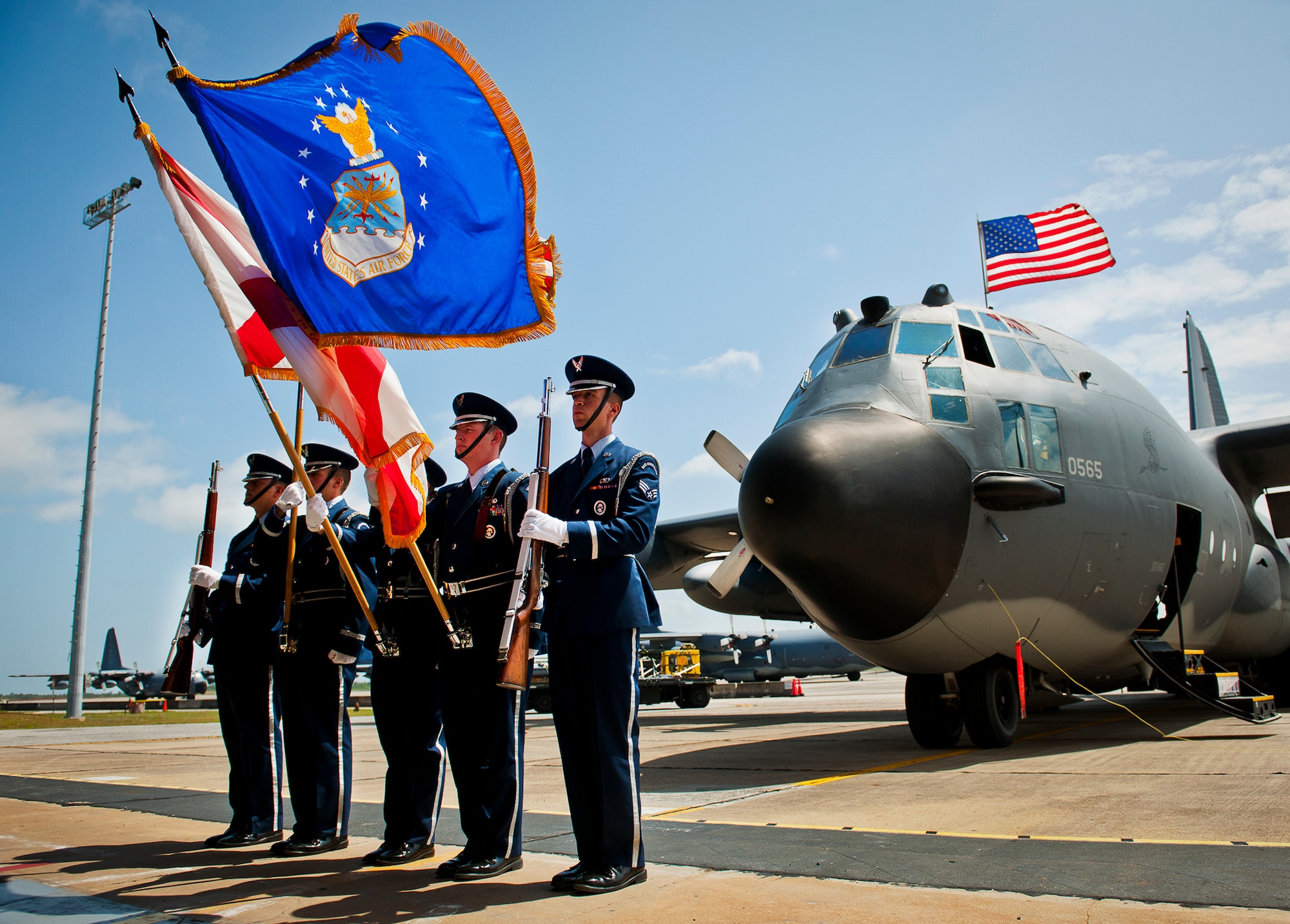 The Eglin Honor Guard presents the colors in the shadow of an MC-130E Combat Talon I during its retirement ceremony at Duke Field, Fla., April 25.  Aircrew, maintainers and many others turned out to remember and bid farewell to the Talon I on its official retirement from the Air Force.  The last five Talons, located at Duke Field, will be delivered to the “boneyard” at Davis-Monthan Air Force Base, N.M., by mid-May 2013.  (U.S. Air Force photo/Tech. Sgt. Samuel King Jr.)
