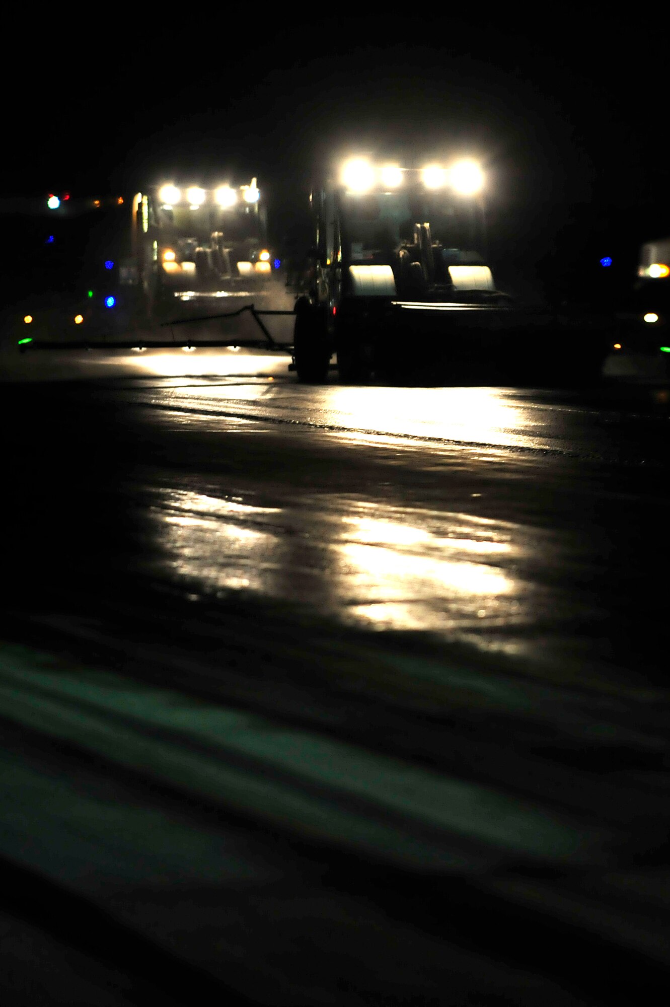 Members of the 577th Expeditionary Prime Beef Squadron remove rubber on the runway using a detergent called Avion 50 at an undisclosed location in Southwest Asia Mar. 29, 2013. The 380th Air Expeditionary Wing was selected as the team's "proof of principle" and successfully paved the way for future rubber removal projects at other airfields where local expertise is not available and costly to acquire. (U.S. Air Force photo by Tech. Sgt. Christina M. Styer)