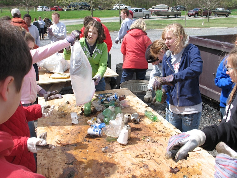 Volunteers sort recyclables from litter collected at Raystown Lake Cleanup Day.