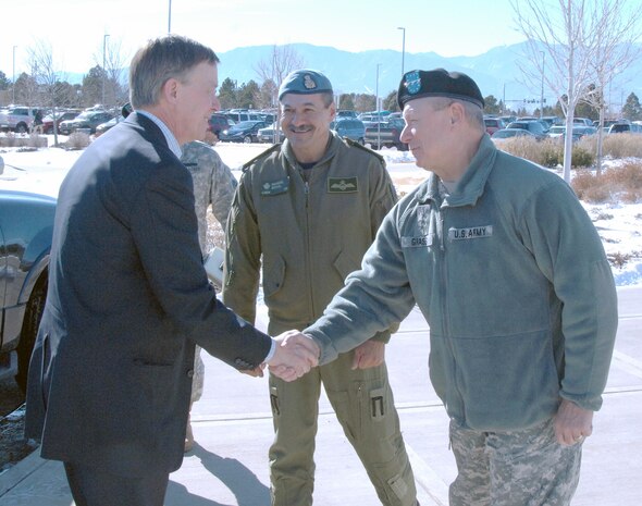 PETERSON AIR FORCE BASE, Colo. – Colorado Governor John Hickenlooper shakes hands with Army Lt. Gen. Frank Grass, U.S. Northern Command deputy commander, and Canadian Lt.-Gen. Marcel Duval, North American Aerospace Defense Command deputy commander, at the beginning of a visit to NORAD and USNORTHCOM headquarters on Peterson Air Force Base, Colo., Feb. 10. Hickenlooper received a briefing outlining the missions of the commands and a tour of the NORAD and USNORTHCOM Command Center. 

(U.S. Air Force photo by Staff Sgt. Thomas J. Doscher) 

