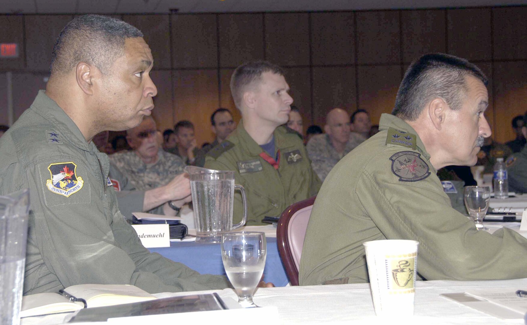 TYNDALL AIR FORCE BASE, Fla. - (Left to right) Air Force Maj. Gen. Garry C. Dean, Continental U.S. North American Aerospace Defense Command Region-1st Air Force and Air Forces Northern commander; Brig. Gen. Christopher Coates, CONR deputy commander; and Canadian Lt. Gen. Marcel Duval, NORAD deputy commander, listen during the Senior Statesmen Panel Feb. 24. The panel, which featured three retired generals who figured prominently in the shaping of 1st AF, was the highlight of the 1st AF Commander’s Conference held at the Horizons Community Center at Tyndall Air Force Base, Fla. 

(U.S. Air Force photo by Angela Pope)

