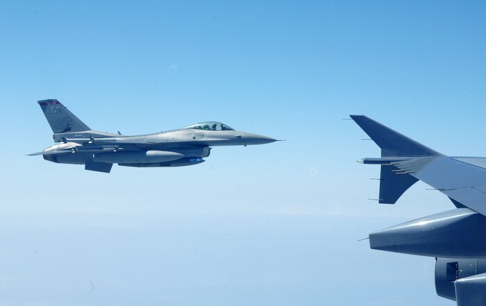 OVER THE GULF OF MEXICO - An F-16 fighter from the 138th Fighter Wing, Detachment 1, comes up alongside a Canadian CC-150 during an Amalgam Mute exercise March 15. The North American Aerospace Defense Command Inspector General's Office conducts periodic inspections of NORAD's alert units, testing their ability to employ and control fighters in a variety of scenarios. 

(U.S. Air Force photo by Tech. Sgt. Thomas J. Doscher) 

