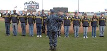COLORADO SPRINGS, Colo. - Navy Adm. James Winnefeld, North American Aerospace Defense Command and U.S. Northern Command commander, gives the oath of enlistment to 12 U.S. Navy enlistees at the Sky Sox - Grizzlies game at Security Services Field May 3. The Admiral was also invited to throw out the first pitch. 

(U.S. Air Force photo by Tech. Sgt. Thomas J. Doscher) 

