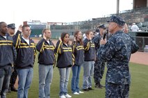 COLORADO SPRINGS, Colo. - Navy Adm. James Winnefeld, North American Aerospace Defense Command and U.S. Northern Command commander, gives the oath of enlistment to 12 U.S. Navy enlistees at the Sky Sox - Grizzlies game at Security Services Field May 3. The Admiral was also invited to throw out the first pitch. 

(U.S. Air Force photo by Tech. Sgt. Thomas J. Doscher) 

