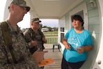 Army National Guard Sgt Thomas Brown, right, and Staff Sgt Cory Brown, notify mobile home resident Charlotte Wright about a mandatory evacuation order in Gulfport, Miss. Aug. 31. All Federal Emergency Management Agency trailer residents in Gulfport are under a mandatory evacuation order in anticipation of Hurricane Gustav making landfall. Both guardsmen are from A Troop, 1-98 Cavalry Regiment, Pontotoc, Miss.