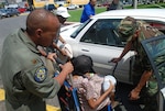 Members of the Louisiana Air National Guard medical team assist a special-needs resident at the Union Passenger Terminal Station in New Orleans on Aug. 30, 2008, as she prepares to be evacuated prior to the arrival of Hurricane Gustav.
