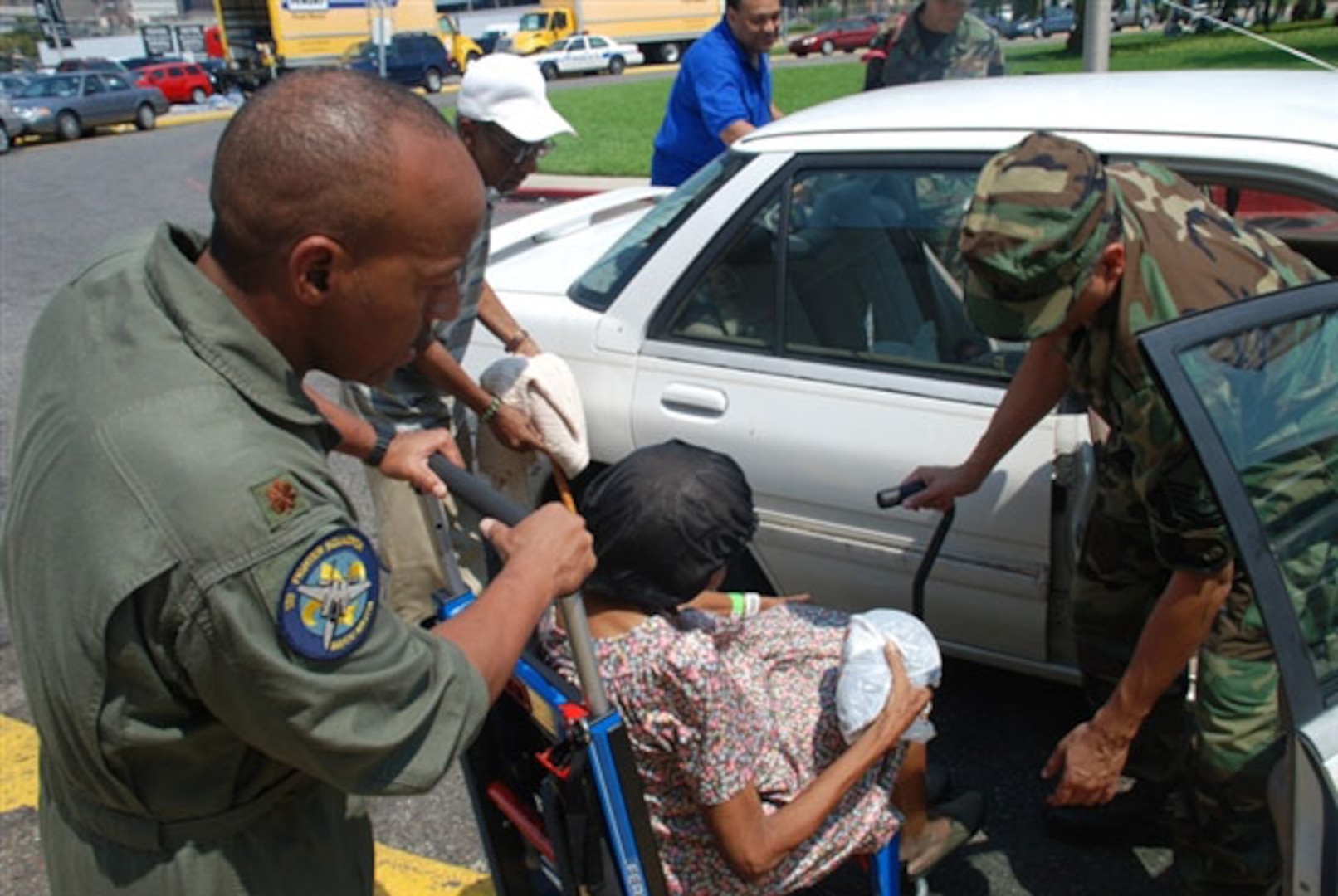 Members of the Louisiana Air National Guard medical team assist a special-needs resident at the Union Passenger Terminal Station in New Orleans on Aug. 30, 2008, as she prepares to be evacuated prior to the arrival of Hurricane Gustav.