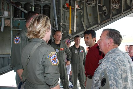 Governor of Louisiana Bobby Jindal, in red shirt, and Maj. Gen. Bennett C. Landreneau, the adjutant general of the Louisiana National Guard, talk to crew members from the 118th Aeromedical Evacuation Squadron of Nashville, Tenn. He thanked the crew for its rapid response and support to Hurricane Gustav. The crew operated from the New Orleans Lakefront Airport beginning on Aug. 31.