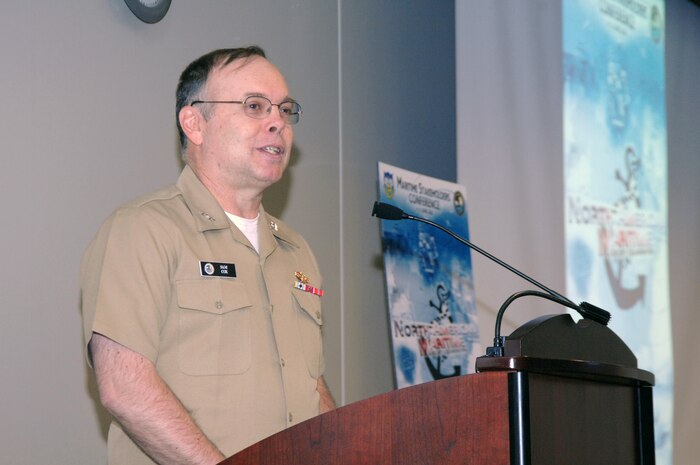 PETERSON AIR FORCE BASE, Colo. - Navy Rear Adm. Samuel Cox, National Maritime Intelligence Center director, gives opening remarks at the 2nd annual NORAD and USNORTHCOM Maritime Stakeholders Conference June 1. The conference brings together military and civilian maritime agencies to discuss security and information sharing. The conference runs through June 3. 

(U.S. Air Force photo by Tech. Sgt. Thomas J. Doscher) 

