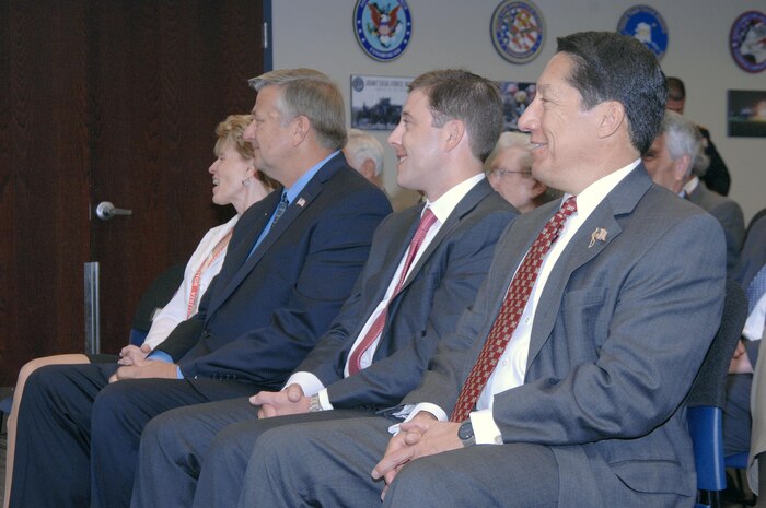 PETERSON AIR FORCE BASE, Colo. - Kevin Estrem, Christian Anschutz, and Lionel Rivera listen to opening remarks by Navy Adm. James Winnefeld, North American Aerospace Defense Command and U.S. Northern Command commander, before receiving the Commander's Community Leader Commendation award at a ceremony at NORAD and USNORTHCOM headquarters July 29. 

(U.S. Air Force photo by Tech. Sgt. Thomas J. Doscher) 

